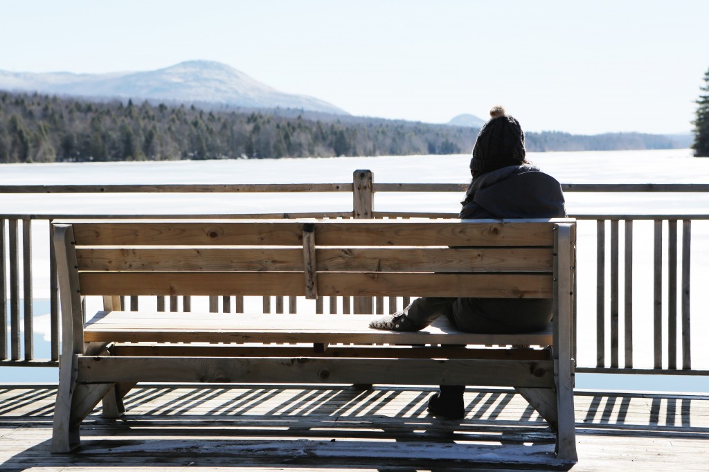 woman bench lake